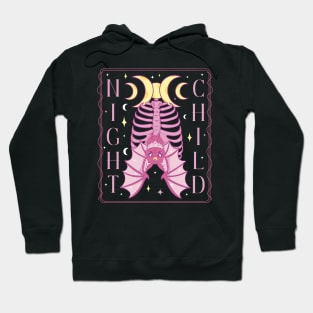 A bat hangs from a rib cage under the triple moon with the words night child occult witchcraft design Hoodie